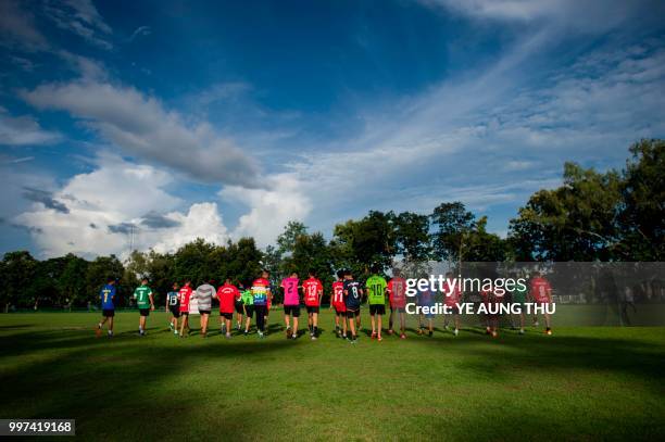 This photo taken on July 12, 2018 shows members of the "Wild Boars" football team taking part in a training session at a school in the Mae Sai...