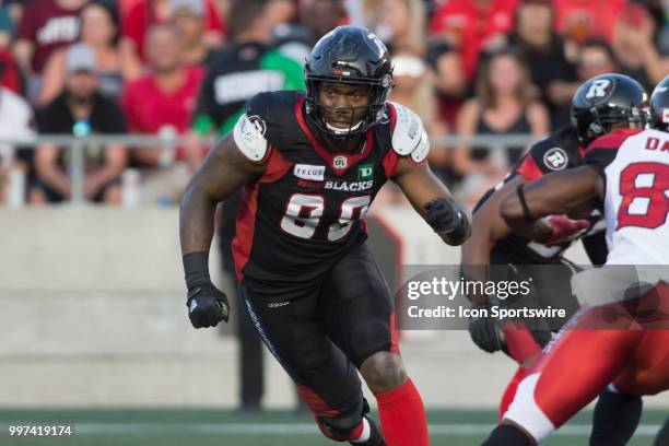 Avery Ellis of the Ottawa Redblacks rushes the Calgary Stampeder pass in a regular season Canadian Football League game played at TD Place Stadium in...
