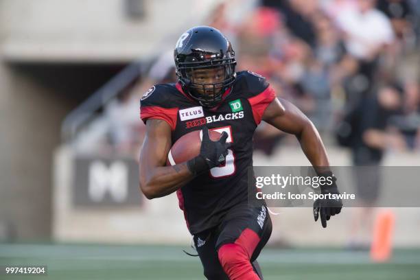 Loucheiz Purifoy of the Ottawa Redblacks runs the ball back against the Calgary Stampeders in a regular season Canadian Football League game played...