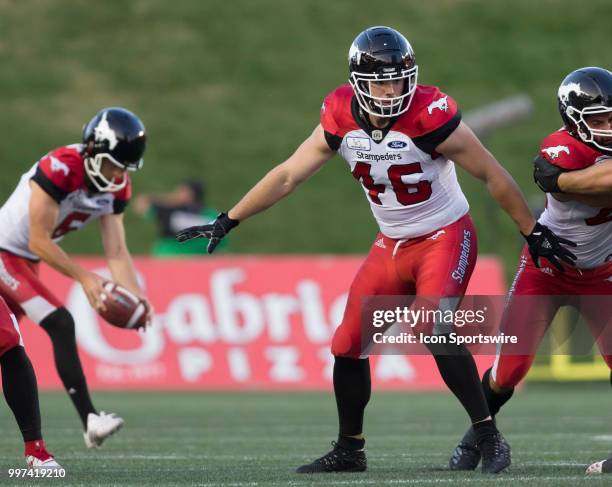 Charlie Power of the Calgary Stampeders defends his kicker in a regular season Canadian Football League game played at TD Place Stadium in Ottawa....