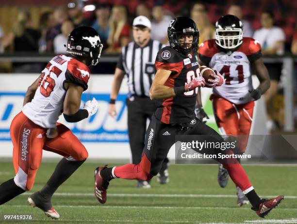 Brad Sinopoli of the Ottawa Redblacks tries to run upfield against the Calgary Stampeders in a regular season Canadian Football League game played at...