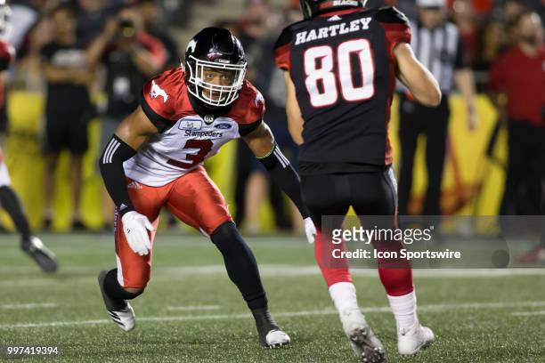 Patrick Levels of the Calgary Stampeders closes in to tackle an Ottawa Redblack receiver in a regular season Canadian Football League game played at...