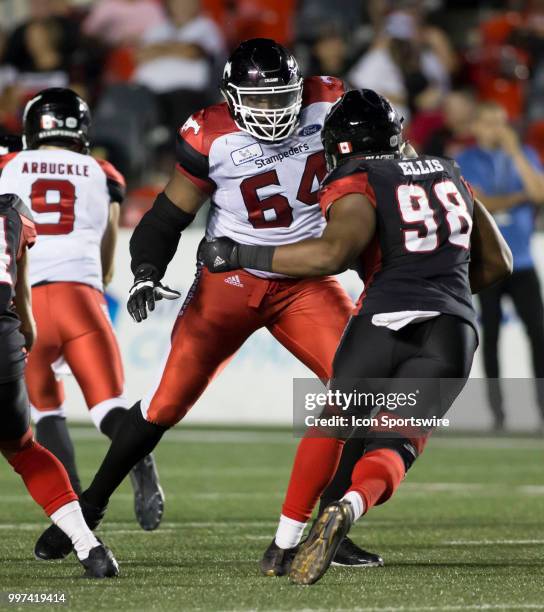 Justin Renfrow of the Calgary Stampeders closes down the Ottawa Redblacks pass rush in a regular season Canadian Football League game played at TD...