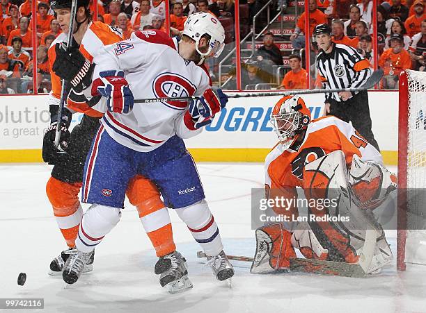 Chris Pronger and Michael Leighton of the Philadelphia Flyers stop a shot on goal by Tom Pyatt of the Montreal Canadiens in Game One of the Eastern...