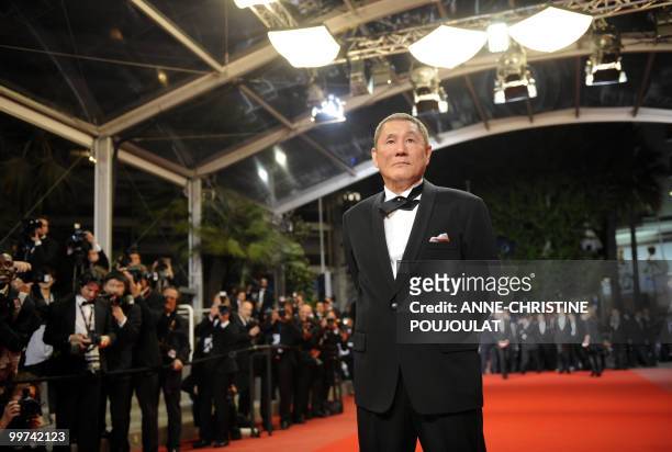 Japanese actor and director Takeshi Kitano arrives for the screening of "Outrage" presented in competition at the 63rd Cannes Film Festival on May...