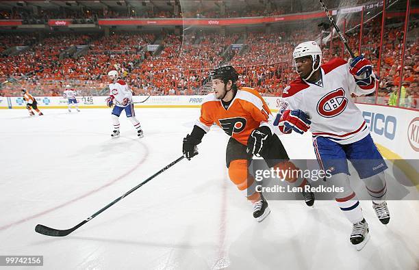 Dan Carcillo of the Philadelphia Flyers skates against PK Subban of the Montreal Canadiens in Game One of the Eastern Conference Finals during the...