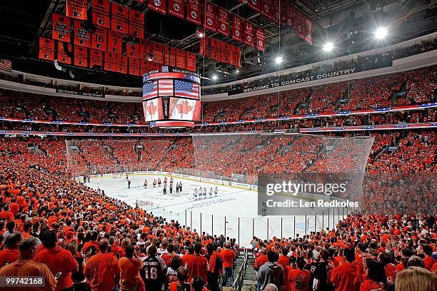 General view as members of the Philadelphia Flyers and the Montreal Canadiens stand during the playing of the Canadien and American National Anthems...