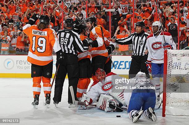 Danny Briere, Braydon Coburn, and Scott Hartnell of the Philadelphia Flyers celebrate Coburn's goal at 3:55 of the first period against goaltender...