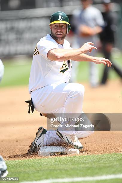 Kevin Kouzmanoff of the Oakland Athletics sliding into third during the game against the Tampa Bay Rays at the Oakland Coliseum on May 8, 2010 in...
