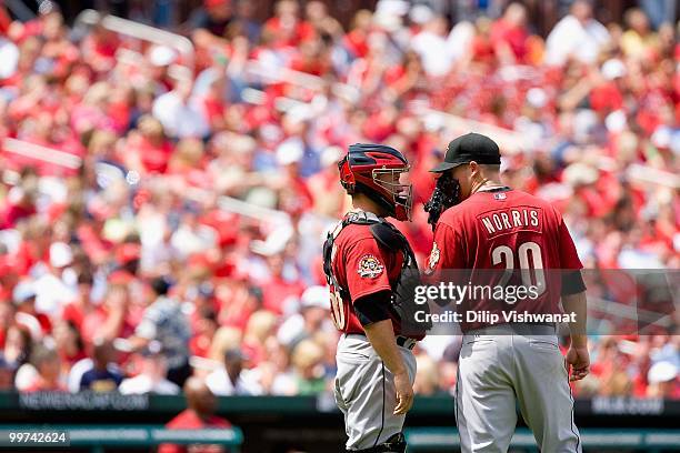 Starting pitcher Bud Norris and Humberto Quintero both of the Houston Astros meet on the mound against the St. Louis Cardinals at Busch Stadium on...