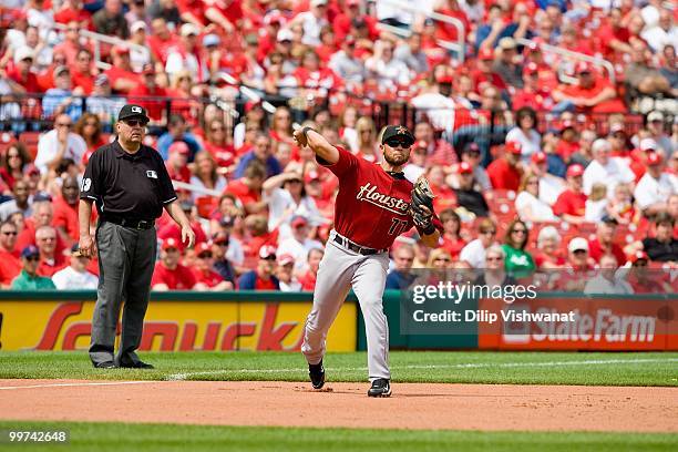 Pedro Feliz of the Houston Astros throws to first base against the St. Louis Cardinals at Busch Stadium on May 13, 2010 in St. Louis, Missouri. The...