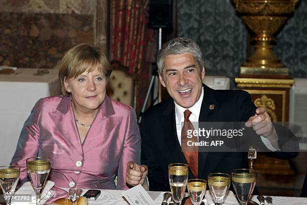 German Chancellor Angela Merkel and Portugal's Prime Minster Jose Socrates attend a gala dinner at The Royal Palace in Madrid on May 17, 2010....