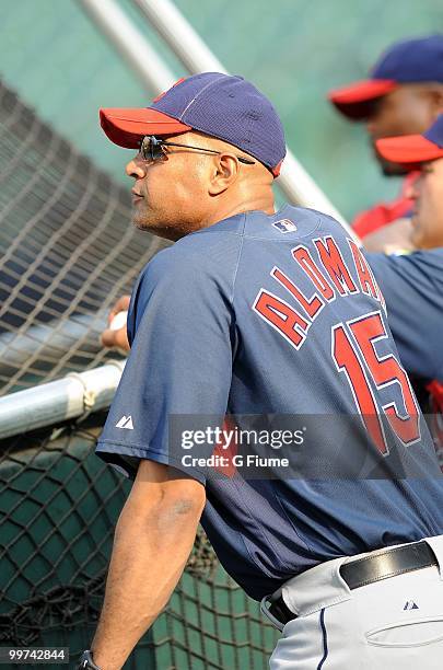 First base coach Sandy Alomar Jr. #15 of the Cleveland Indians watches batting practice before the game against the Baltimore Orioles at Camden Yards...