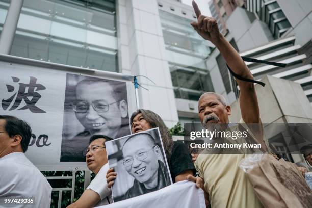 Protesters holding placards of Liu Xiaobo march on a street on July 13, 2018 in Hong Kong, Hong Kong. July 13 marks one year anniversary of late...