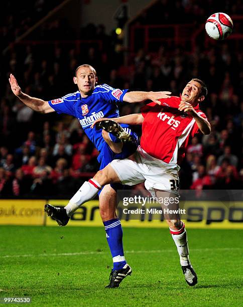 Scott Cuthbert of Swindon challenges Nicky Forster of Charlton during the Coca-Cola League One Playoff Semi Final 2nd Leg between Charlton Athletic...