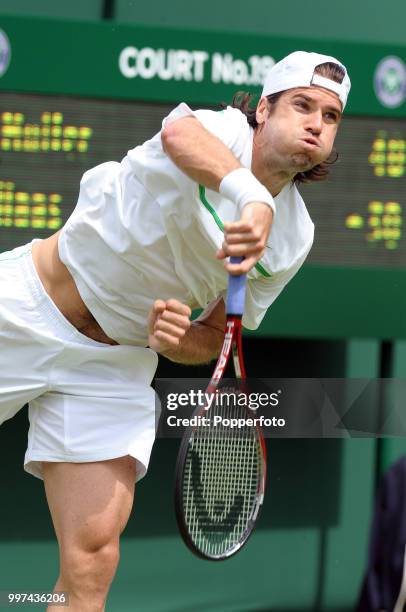 Tommy Haas of Germany in action on Day One of the Wimbledon Lawn Tennis Championships at the All England Lawn Tennis and Croquet Club in London on...