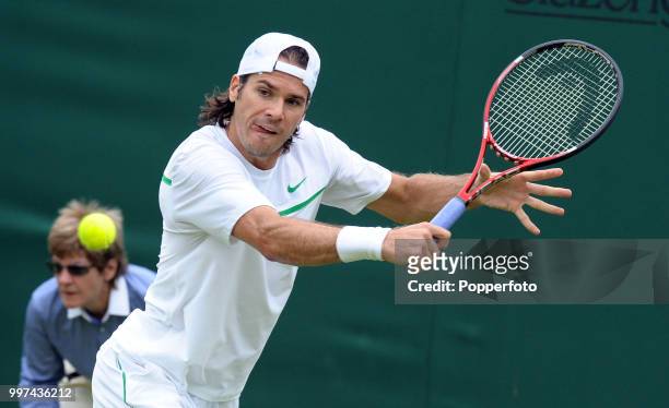 Tommy Haas of Germany in action on Day One of the Wimbledon Lawn Tennis Championships at the All England Lawn Tennis and Croquet Club in London on...