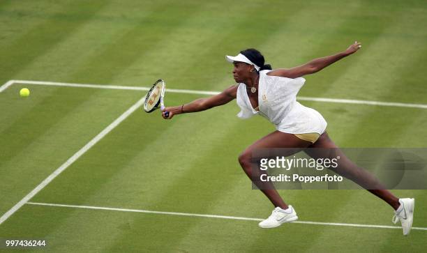 Venus Williams of the USA in action on Day One of the Wimbledon Lawn Tennis Championships at the All England Lawn Tennis and Croquet Club in London...