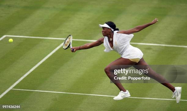 Venus Williams of the USA in action on Day One of the Wimbledon Lawn Tennis Championships at the All England Lawn Tennis and Croquet Club in London...