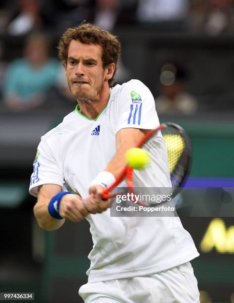 Andy Murray of Great Britain in action on Day One of the Wimbledon Lawn Tennis Championships at the All England Lawn Tennis and Croquet Club in...