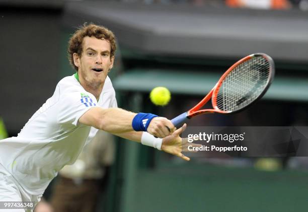 Andy Murray of Great Britain in action on Day One of the Wimbledon Lawn Tennis Championships at the All England Lawn Tennis and Croquet Club in...