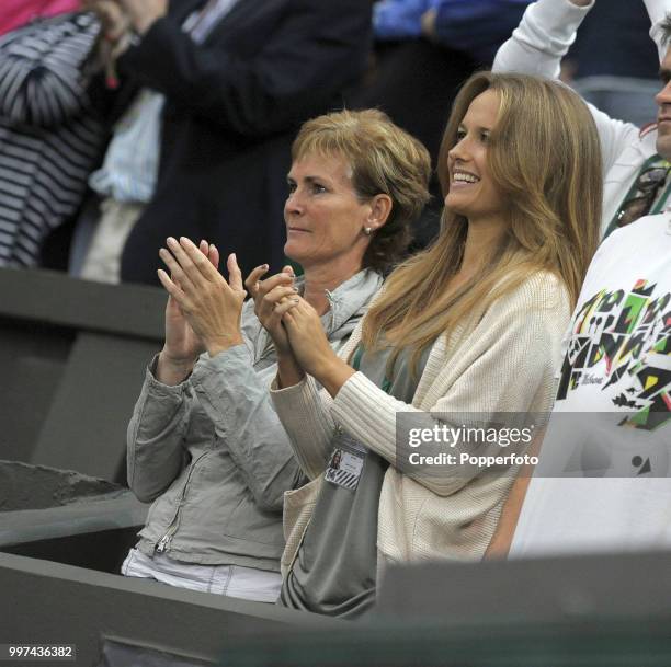 Judy Murray and Kim Sears, the mother and girlfriend of Andy Murray of Great Britain, applaud his victory following his first round match on Day One...