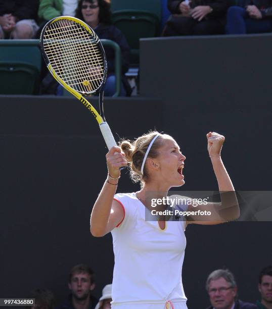 Mathilde Johansson of France reacts on Day Three of the Wimbledon Lawn Tennis Championships at the All England Lawn Tennis and Croquet Club in London...