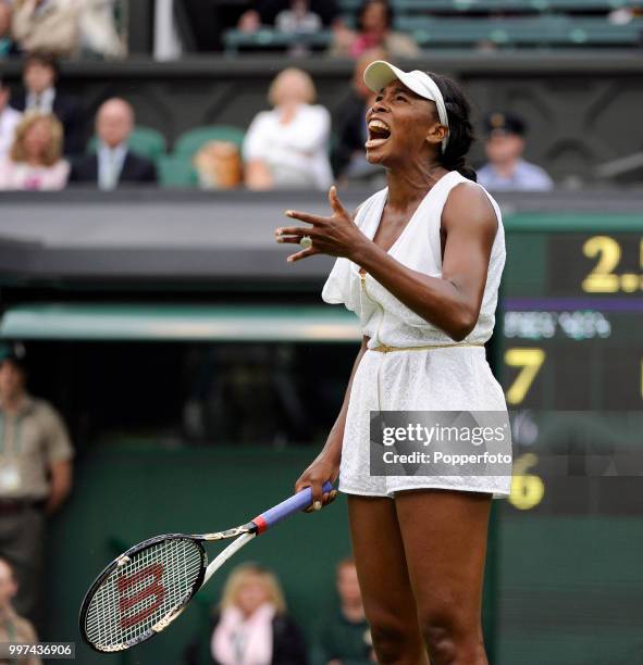 Venus Williams of the USA reacts during her match on Day Two of the Wimbledon Lawn Tennis Championships at the All England Lawn Tennis and Croquet...