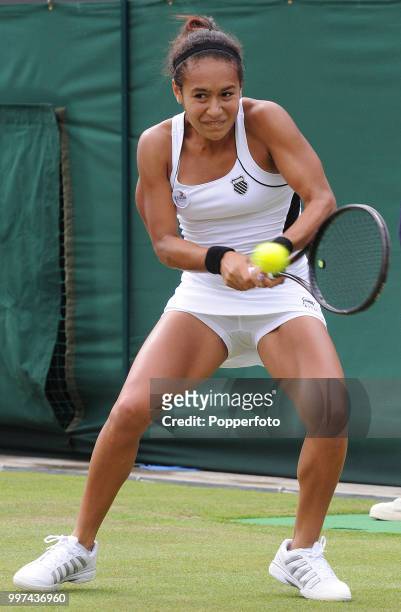 Heather Watson of Great Britain in action on Day Three of the Wimbledon Lawn Tennis Championships at the All England Lawn Tennis and Croquet Club in...