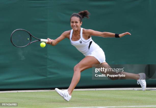 Heather Watson of Great Britain in action on Day Three of the Wimbledon Lawn Tennis Championships at the All England Lawn Tennis and Croquet Club in...