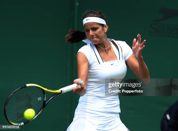 Julia Goerges of Germany in action on Day Four of the Wimbledon Lawn Tennis Championships at the All England Lawn Tennis and Croquet Club in London...