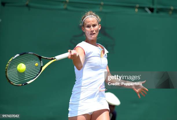 Mathilde Johansson of France in action on Day Four of the Wimbledon Lawn Tennis Championships at the All England Lawn Tennis and Croquet Club in...