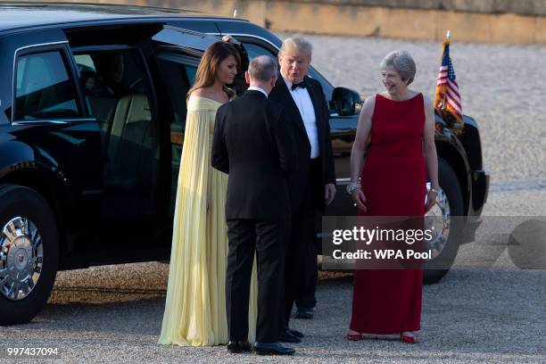 Britain's Prime Minister Theresa May and her husband Philip May greet U.S. President Donald Trump and First Lady Melania Trump at Blenheim Palace on...