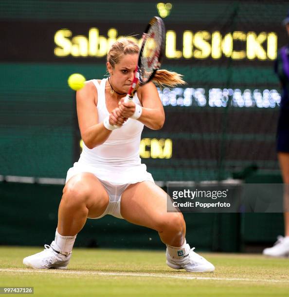 Sabine Lisicki of Germany in action on Day Four of the Wimbledon Lawn Tennis Championships at the All England Lawn Tennis and Croquet Club in London...