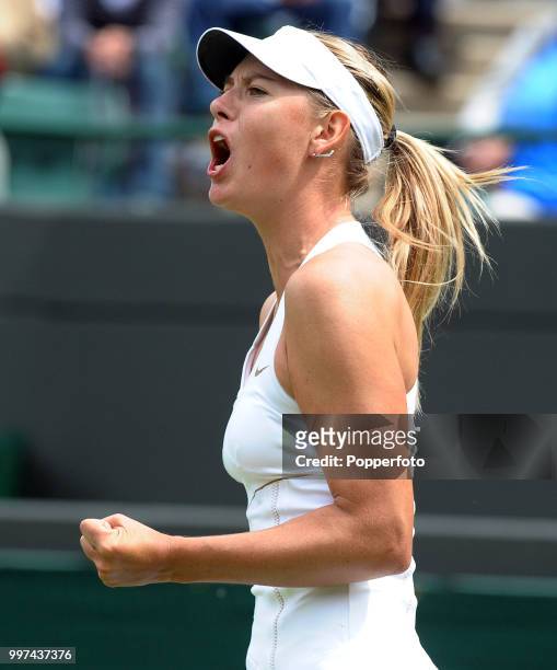 Maria Sharapova of Russia reacts during her match on Day Five of the Wimbledon Lawn Tennis Championships at the All England Lawn Tennis and Croquet...