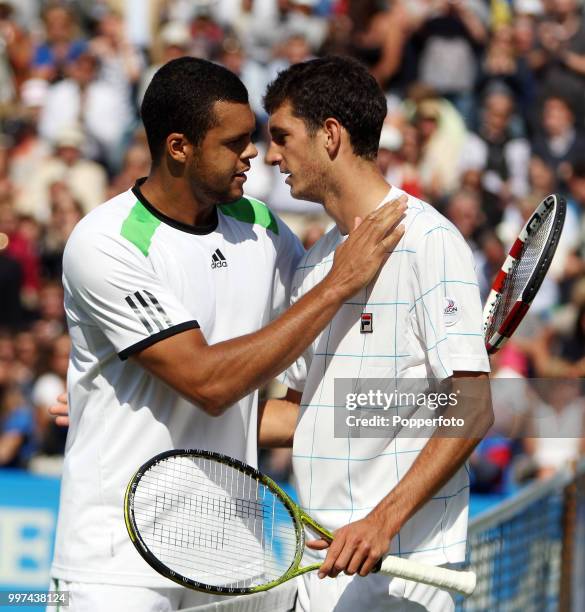 Jo-Wilfried Tsonga of France with James Ward of Great Britain after their match on day 6 of the AEGON Classic at the Edgbaston Priory Club in...