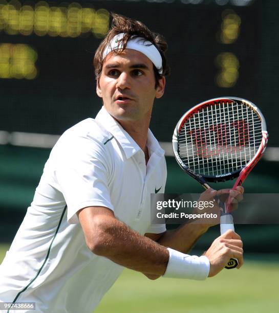 Roger Federer of Switzerland in action on Day Two of the Wimbledon Lawn Tennis Championships at the All England Lawn Tennis and Croquet Club in...