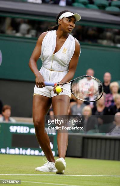 Venus Williams of the USA in action on Day Two of the Wimbledon Lawn Tennis Championships at the All England Lawn Tennis and Croquet Club in London...