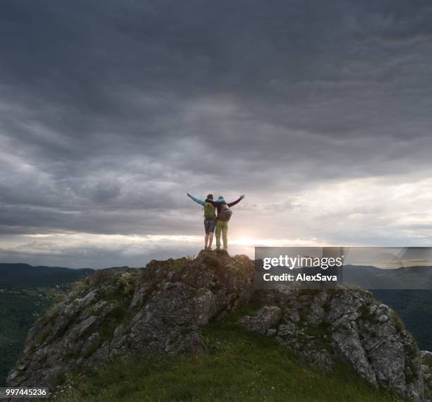 friends celebrating their success on the mountain - rgb stock pictures, royalty-free photos & images