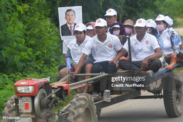 Supporters of the ruling Cambodian People's Party during a party election rally, as the general election campaign kicked off on Saturday, 7 July...