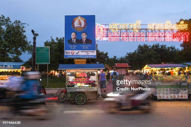 An election poster with images of Heng Samrin - Honorary President of the Cambodian People's Party and Hun Sen - Prime Minister of Cambodia and...