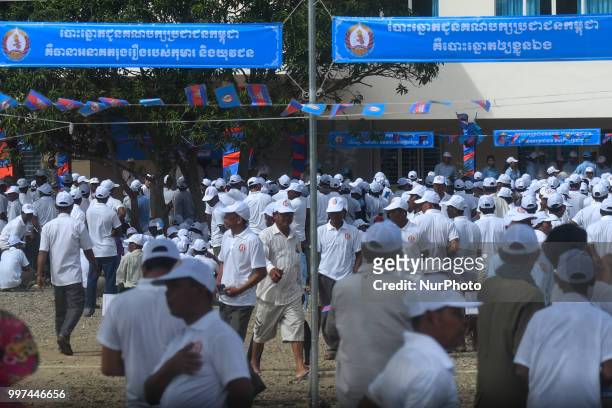 Supporters of the ruling Cambodian People's Party during a party election rally, as the general election campaign kicked off on Saturday, 7 July...