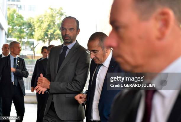 Head of France's intelligence agency DGSI Laurent Nunez and French Prime Minister Edouard Philippe arrive at the DGSI in Levallois-Perret, west of...