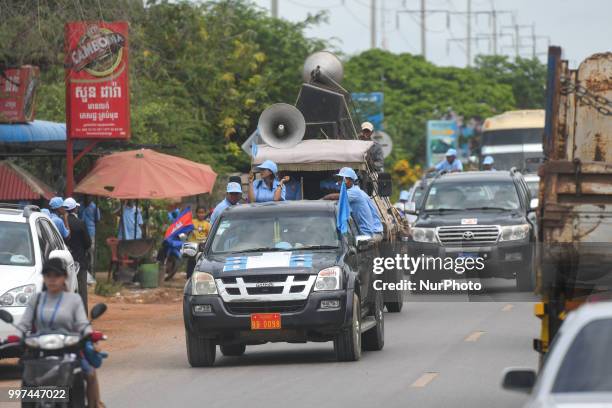 Supporters of the ruling Cambodian People's Party during a party election rally, as the general election campaign kicked off on Saturday, 7 July...