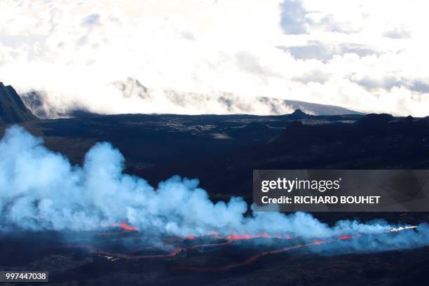 An aerial view taken on July 13 shows steam and lava at the Piton de la Fournaise on the Indian Ocean island of Reunion, which erupted overnight...