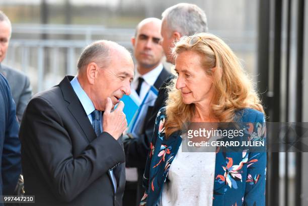 French Minister of the Interior Gerard Collomb and French Justice Minister Nicole Belloubet talk as they arrive at the DGSI in Levallois-Perret, west...
