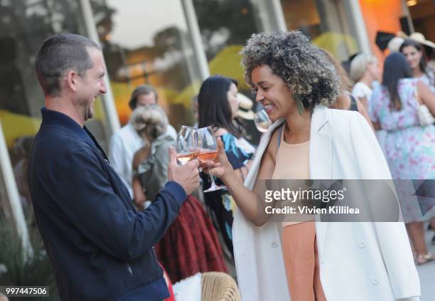 Chris Earl and Amber Earl attend Garance Doré, founder of Atelier Doré, celebrates Au Soleil:A Summer Soirée by Le Méridien  a global programme that...