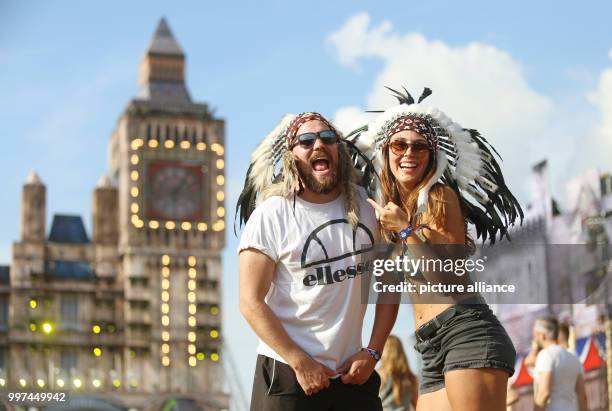 July 2018, Germany, Neustadt-Glewe: Two visitors dressed up at the electro music festival 'Airbeat One'. The festival started on Wednesday with the...