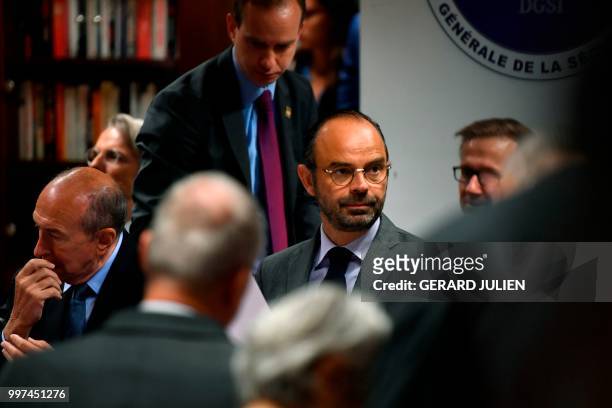 French Prime Minister Edouard Philippe and French Minister of the Interior Gerard Collomb attend the presentation of an anti-terrorism plan at the...