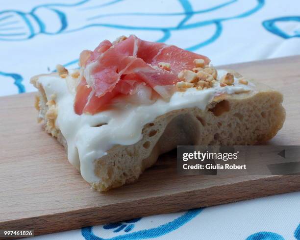 pizza al padellino con seirass, crudo di cuneo e nocciole - crudo stock pictures, royalty-free photos & images